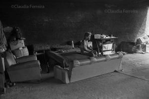 Man With Furniture Under An Overpass 