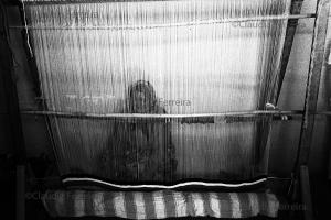 Weaver Works With A Loom