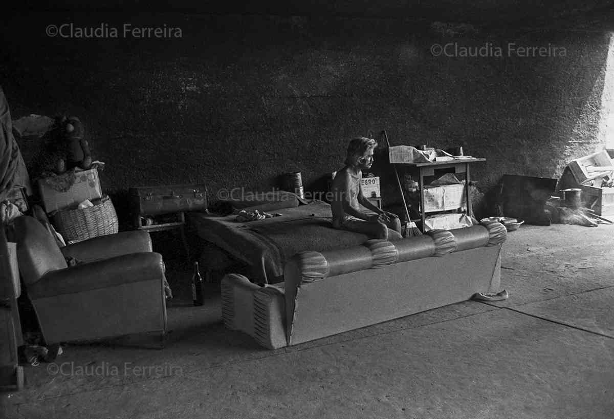 Man With Furniture Under An Overpass 